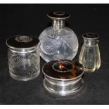 Two silver and tortoiseshell mounted glass scent bottles (one a.f.) a similar box and hair tidy.