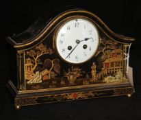 An early 20th century black japanned chinoiserie mantel clock