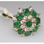 An 18ct gold, emerald and diamond cluster ring, size M.