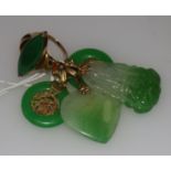 A group of Chinese jadeite jewellery including pendants and ring.