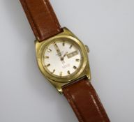 A gentleman's gold plated and steel Tissot PR 516 automatic wrist watch.