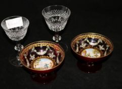 A pair of figurative decorated ruby bowls and a pair of cut glasses