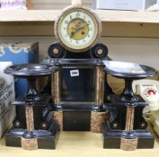 A black and rouge marble clock garniture