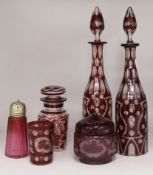 A pair of ruby overlay glass decanters, a pickle jar, glass powder bowl and cranberry shaker