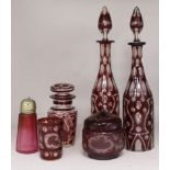 A pair of ruby overlay glass decanters, a pickle jar, glass powder bowl and cranberry shaker