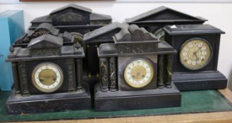 A collection of slate mantel clocks and clock cases, etc.