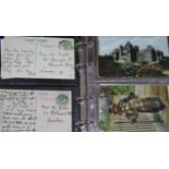 Three albums of postcards