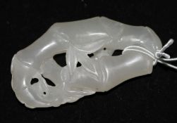 A Chinese pale jade carving of a bat and bamboo, 7cm