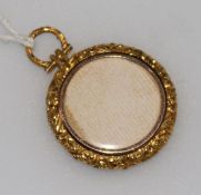 A late 19th/early 20th century yellow metal mounted pendant locket, 30mm.