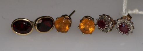 Three pairs of assorted 9ct gold gem set earrings.