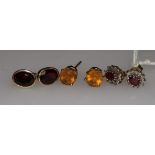 Three pairs of assorted 9ct gold gem set earrings.