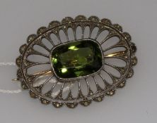 An early 20th century pierced gold, rose cut diamond and green paste set oval brooch, 34mm.