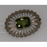 An early 20th century pierced gold, rose cut diamond and green paste set oval brooch, 34mm.