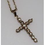 A 9ct gold and diamond set cross pendant on a 9ct gold chain, pendant 1in.