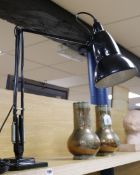 A black Anglepoise lamp