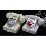 Two white Bakelite telephones