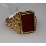 A 9ct gold and carnelian set ring, size V.