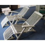 A pair of Indian Ocean teak folding loungers