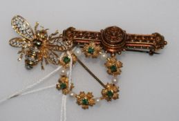 A late Victorian 15ct gold bar brooch, a later 14ct gold bee brooch and a 9ct gold gem set brooch.