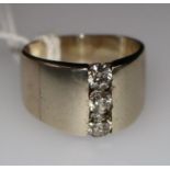 A three stone diamond ring, size N.