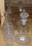 A collection of cut glass decanters