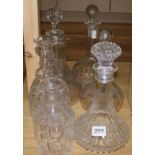 A collection of cut glass decanters