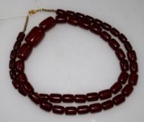 A simulated cherry amber necklace, 36in.