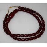 A simulated cherry amber necklace, 36in.