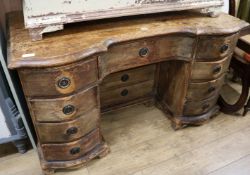 A French pine kneehole desk, W.134cm