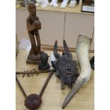 An African carved wood Mask, a Benin style bronze bust, a musical instrument, a horn and a wooden