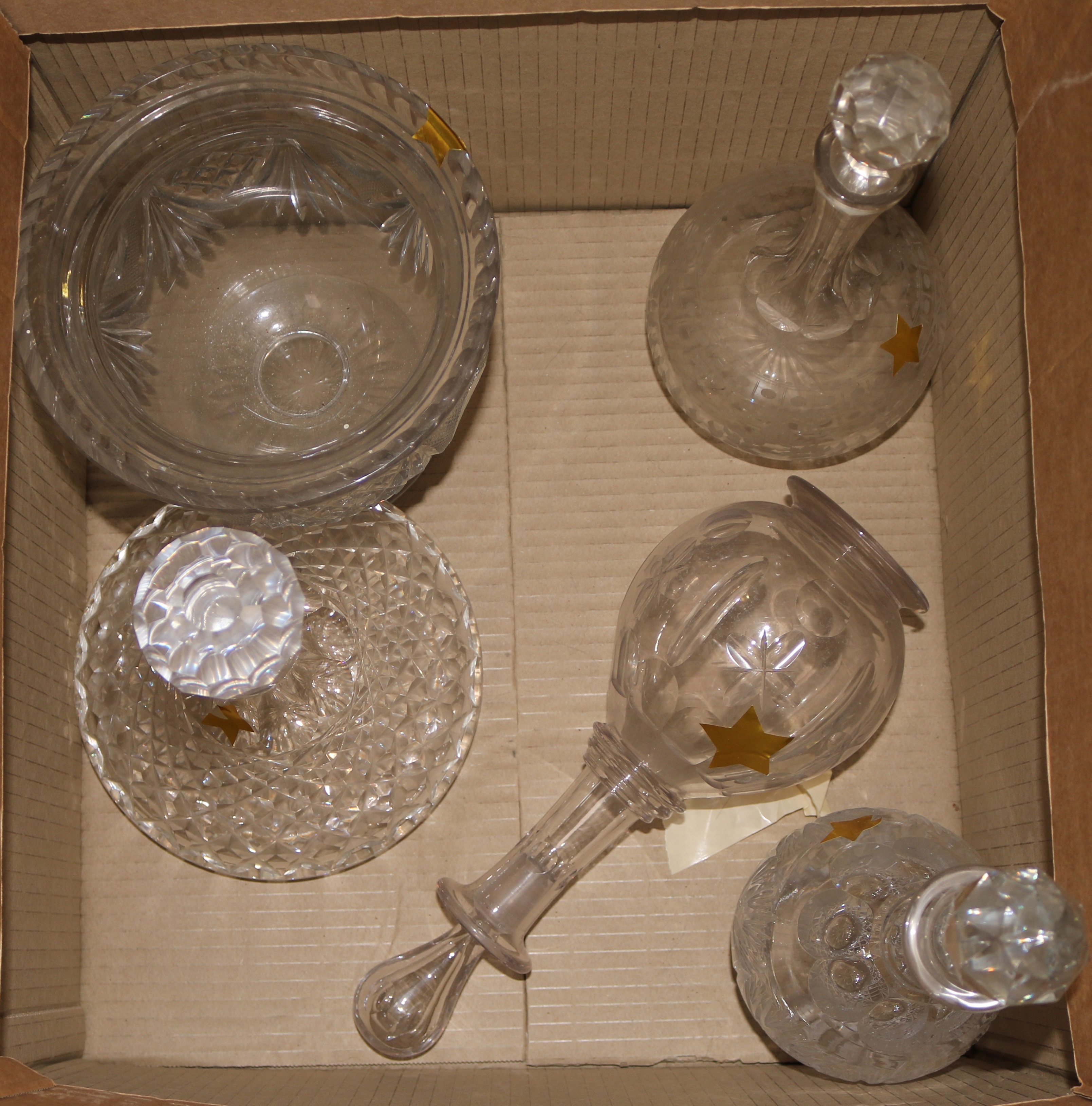 Four assorted cut glass decanters and a pedestal bowl