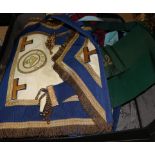 A collection of Masonic regalia from a London lodge, including eight various aprons, sashes,