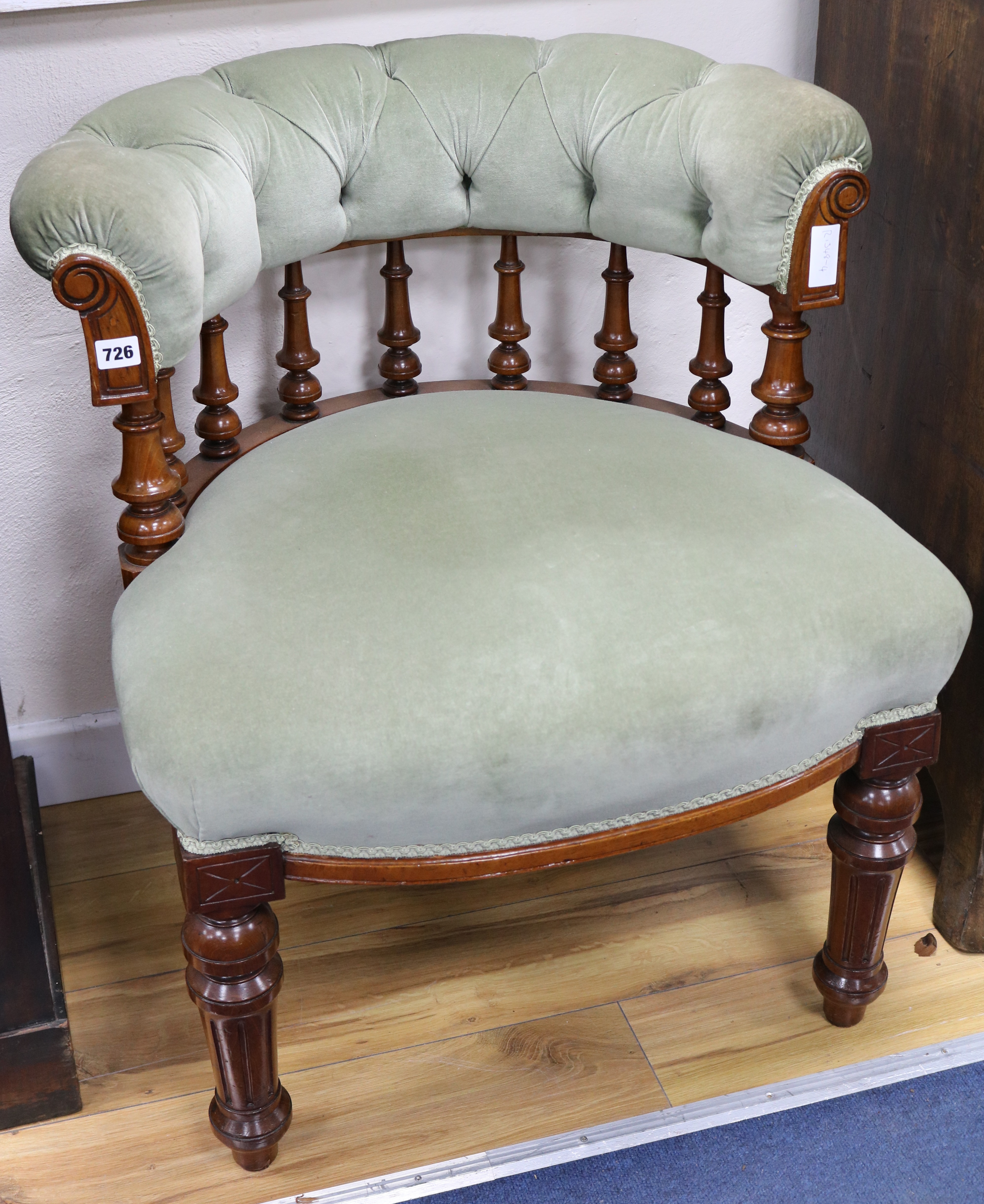 A Victorian mahogany buttoned captains chair,