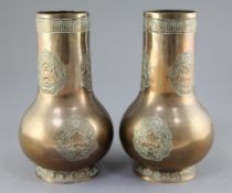 A pair of Chinese bronze archaistic bottle vases, 18th / 19th century, cast in relief with taotie