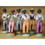 A band of six early 20th century Continental pottery black musicians, 18cm