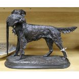 After Jules Moigniez (1835-1894). A bronze model of a Retriever carrying a pheasant, length 38cm