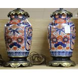 A pair of Victorian brass mounted Imari table lamps, with later fittings, 15in.