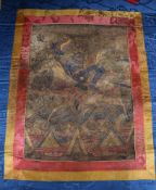 A Tibetan thangka, the central panel 15 x 11in.