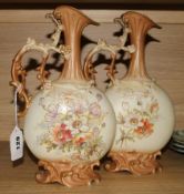 A pair of Continental porcelain ewers, 30cm