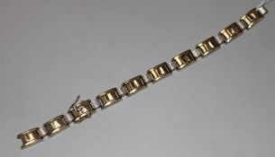 A two-colour rectangular link bracelet marked 9ct gold and platinum(a.f.).