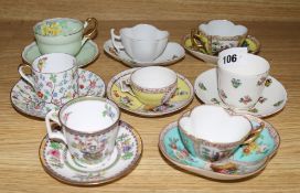 A collection of eight assorted cabinet cups and saucers