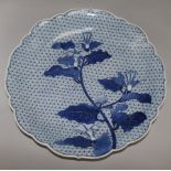 A Japanese blue and white charger, decorated with convolvulus, 15.5in.