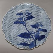 A Japanese blue and white charger, decorated with convolvulus, 15.5in.