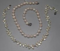 Two modern cultured pearl necklaces with 18ct white gold clasps.