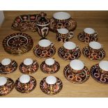 A Royal Crown Derby Imari pattern tea set for six, six coffee cans and saucers, three plates, a vase