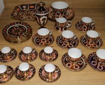 A Royal Crown Derby Imari pattern tea set for six, six coffee cans and saucers, three plates, a vase