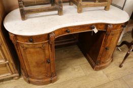A Victorian walnut topped kidney shaped dressing table, W.140cm