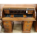 A late Victorian mahogany roll top desk, c.1870, W.107cm