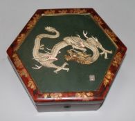 A Japanese lacquer casket, applied with an ivory dragon, c.1920, 10in.