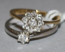 An 18ct gold and diamond cluster ring and a 9ct white gold solitaire diamond ring.